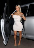 Kim Kardashian looks stunning in a form-fitting white Skims strapless minidress while leaving her office in Calabasas, California