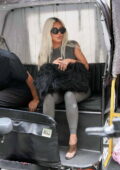 Kim Kardashian sports a grey top and leggings while enjoying a pedicab ride with friends in New York City