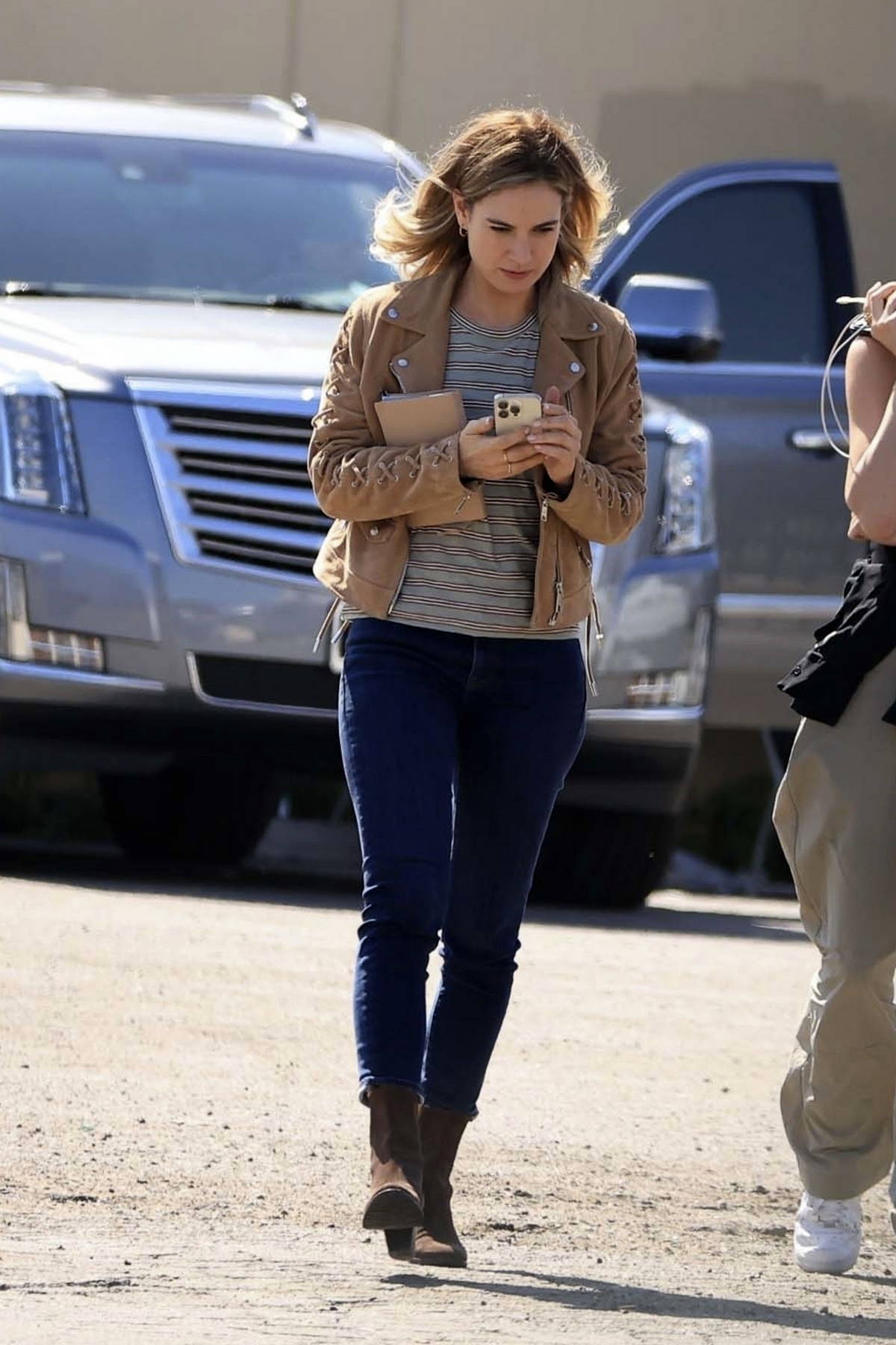 Lily James wears a brown jacket and skinny jeans while spotted on the set of 'Swiped' in Los Angeles