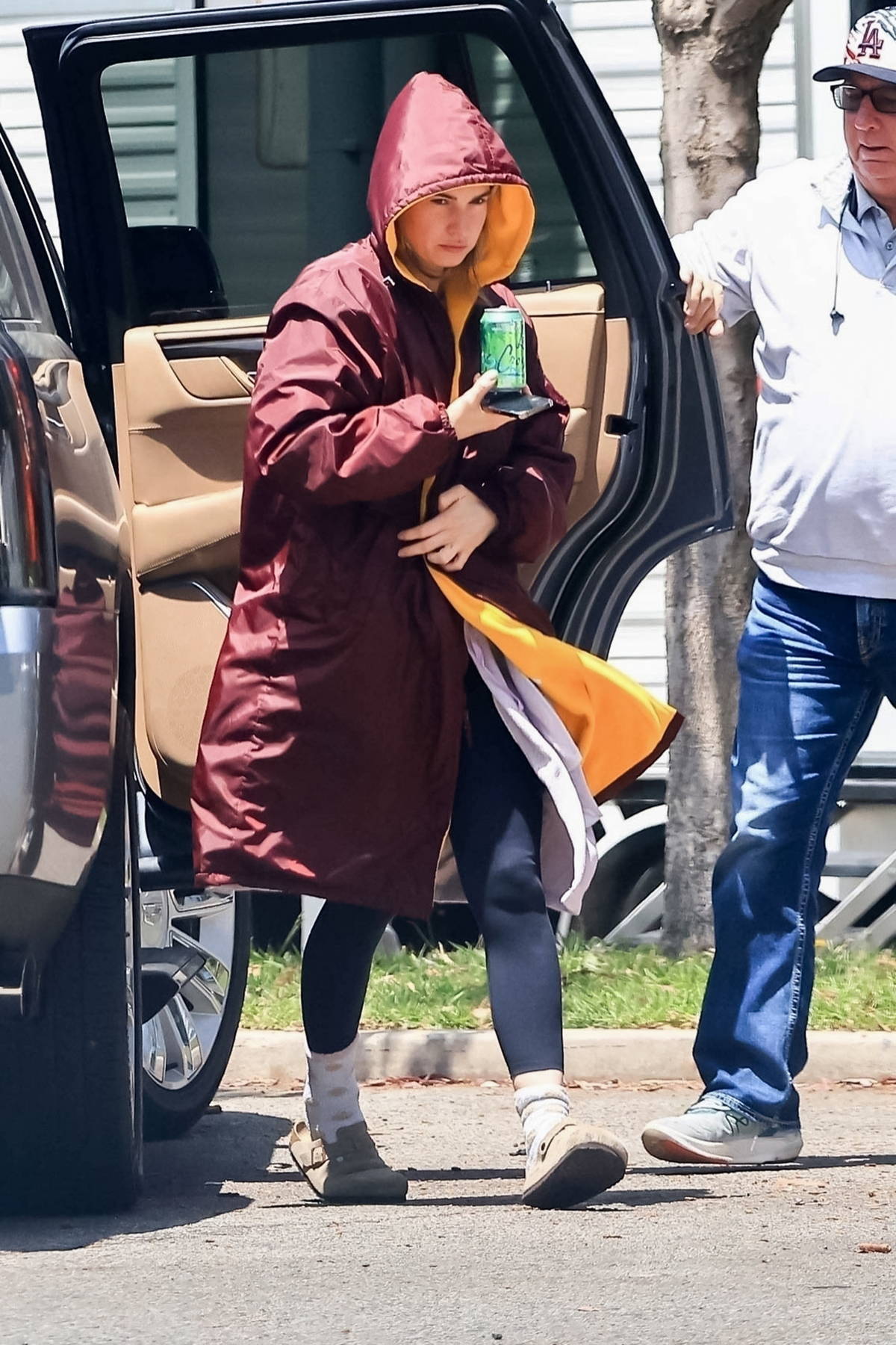 Lily James wears hooded coat as she arrives on the set of 'Swiped' in Los Angeles