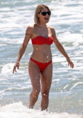 Michelle Hunziker stuns in a red bikini during a relaxing beach day at Alpemare Beach in Forte Dei Marmi, Italy