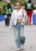 Ashley Roberts flashes her midriff in a white tank top, silver jacket and baggy jeans as she leaves Heart radio in London, England