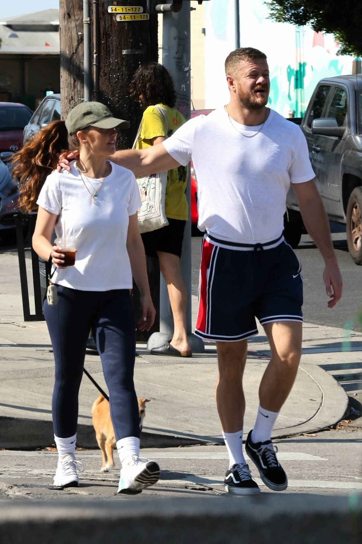 Minka Kelly wears a white tee and black camo leggings while out for lunch with beau Dan Reynolds in Los Feliz, California