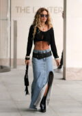 Rita Ora flashes her toned abs in a stylish knitted top and denim skirt stepping out at Bauer Media in London, England