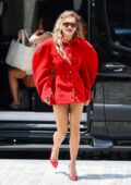 Rita Ora puts on a leggy display in a bright red mini dress during a promo run for 'Descendants: The Rise of Red' in New York City