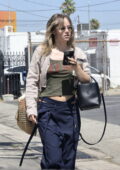 Suki Waterhouse looked busy taking a phone call during a solo outing in Studio City, California