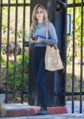 Suki Waterhouse wears a grey sweater and black leggings while visiting a spa in Los Angeles