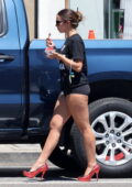 Addison Rae flaunts her legs in tiny black shorts while she picks up a shaved ice in Los Angeles