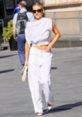 Ashley Roberts looks chic in a white top and matching trousers as she leaves Heart Radio studios in London, England