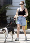 Ava Phillippe dons a black crop top and denim shorts out for a dog walk in Los Angeles