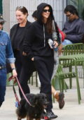 Irina Shayk keeps a low profile in black Burberry hoodie and sweats while enjoying lunch with a friend at Sweetgreen in New York City