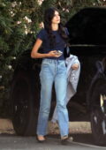 Kaia Gerber cuts a casual figure in a navy tee and jeans while she meets up with Ayo Edebiri at Kunz production company in Los Angeles