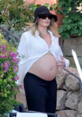 Margot Robbie shows off her growing baby bump in white skirt while enjoying her vacation in Sardinia, Italy