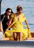 Rita Ora stands out in a bright yellow dress while enjoying her summer holiday in Ibiza, Spain