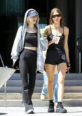 Rosé Park dons a hoodie with black crop top and flared leggings while stopping for a Matcha with a friend in Los Angeles