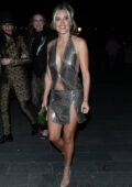 Ashley Roberts dazzles in a metallic silver mini dress during a night out at the Maine Mayfair in London, England