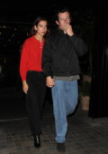 Dua Lipa and Callum Turner hold hands during a night out in London, England