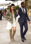 Irina Shayk looks fabulous in a white dress paired with an olive green jacket with matching boots as she exits a Schiaparelli fitting in Paris, France