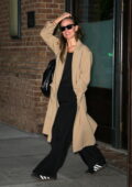 Olivia Wilde is all smiles as she leaves The Greenwich Hotel wearing a beige long coat in New York City