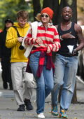 Gigi Hadid wears a striped sweater, beanie and jeans while out with friends in New York City