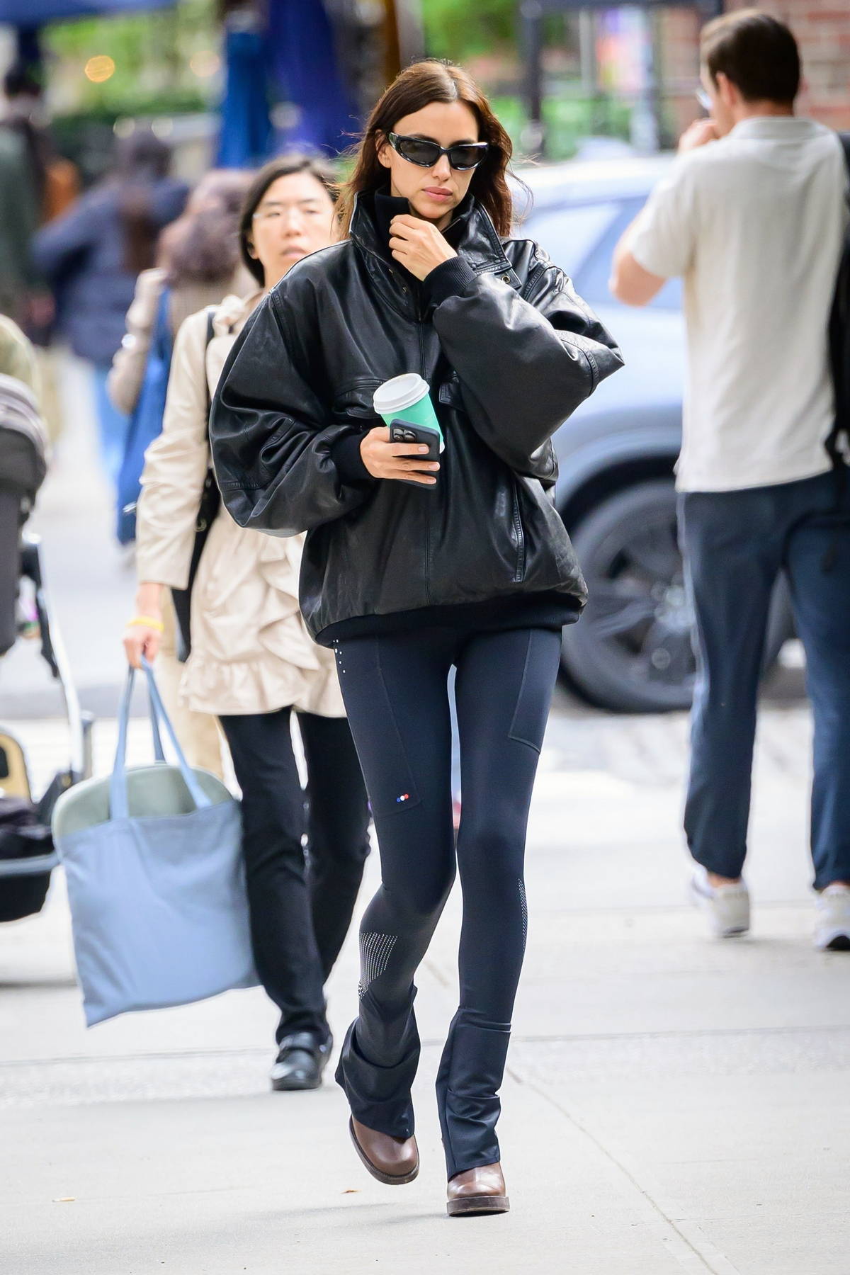 Irina Shayk rocks a leather jacket and leggings while stepping out for coffee in New York City