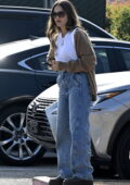 Jessica Alba wears a brown cardigan, white top and jeans while attending her daughter's tennis practice in Santa Monica, California