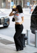 Kylie Jenner rocks a Sprinter crop top and while stopping by several liquor stores during a promo run in New York City