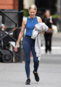 Naomi Watts looks sporty in a blue tank top and leggings while out for a walk in New York City