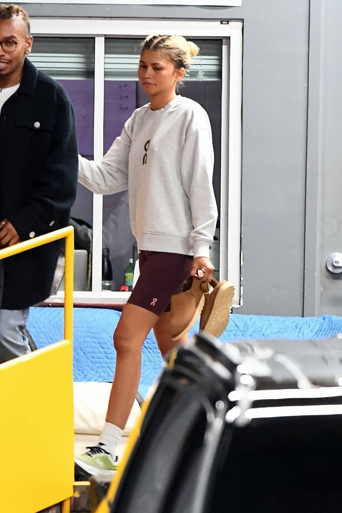 Zendaya dons a sweatshirt and legging shorts as she leaves after a photoshoot at Spring Studios in New York City