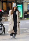 Anne Hathaway keeps it stylish in a beige winter coat and a beanie while stepping out in New York City